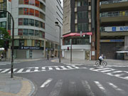 Turn left at the corner of “The suit company”